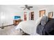Well-lit main bedroom with a ceiling fan and an ensuite bathroom at 3385 Ne 44Th Pl, Ocala, FL 34479