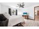 Bright bedroom with a ceiling fan, large window and neutral wall color at 3385 Ne 44Th Pl, Ocala, FL 34479