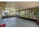 Spacious screened porch with a hammock, offering a relaxing outdoor living space at 3385 Ne 44Th Pl, Ocala, FL 34479