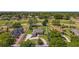 Aerial view showcasing the property's boundaries, highlighting the house, driveway, and lush green surroundings at 39601 Harbor Hills Blvd, Lady Lake, FL 32159