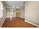 Spacious bedroom with hardwood floors, ceiling fan, and ensuite bathroom at 39601 Harbor Hills Blvd, Lady Lake, FL 32159