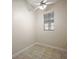 Cozy bedroom with neutral walls, tile floors, and a bright window providing natural light at 39601 Harbor Hills Blvd, Lady Lake, FL 32159