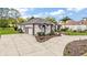 Charming exterior of a single-story home with a well-manicured front yard and driveway at 39601 Harbor Hills Blvd, Lady Lake, FL 32159