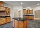 Chef's kitchen with a center island, granite countertops and an open layout for easy entertaining at 39601 Harbor Hills Blvd, Lady Lake, FL 32159
