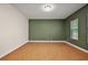 Spacious living room featuring hardwood floors and neutral paint, ready for new decor at 39601 Harbor Hills Blvd, Lady Lake, FL 32159