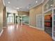 Open living room featuring hardwood floors, high ceilings, and neutral paint, with formal dining at 39601 Harbor Hills Blvd, Lady Lake, FL 32159
