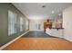 Open-concept living space flows into kitchen with breakfast bar, perfect for entertaining guests at 39601 Harbor Hills Blvd, Lady Lake, FL 32159