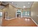 Spacious living room featuring hard wood floors, tray ceilings and archways leading to other rooms at 39601 Harbor Hills Blvd, Lady Lake, FL 32159