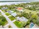 The property features a large, well-maintained lawn, mature trees for shade, and a peaceful neighborhood setting near the waterfront at 59 Amsden Rd, Ormond Beach, FL 32176