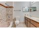 Bathroom featuring a tiled shower-tub and vanity with mirrored wall at 59 Amsden Rd, Ormond Beach, FL 32176