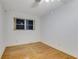 A bright bedroom with hardwood floors and a window at 59 Amsden Rd, Ormond Beach, FL 32176