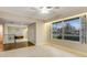 Cozy living room with ceiling fan and large window overlooking the front yard at 59 Amsden Rd, Ormond Beach, FL 32176