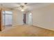 Bedroom featuring a ceiling fan, three doorways and carpet at 59 Amsden Rd, Ormond Beach, FL 32176
