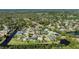 High-angle view displays a peaceful residential area with tree-lined streets and nearby lakes at 6172 Knotty Pine Ct, Port Orange, FL 32127