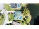 Aerial of a beautiful home, pool and covered patio overlooking a tranquil pond at 6172 Knotty Pine Ct, Port Orange, FL 32127