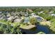 A beautiful waterfront property with a pool and an enclosed patio overlooking the lake at 6172 Knotty Pine Ct, Port Orange, FL 32127