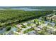 Waterfront homes in a desirable neighborhood featuring lush green trees and stunning waterfront views and neighborhood pool at 6172 Knotty Pine Ct, Port Orange, FL 32127