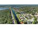 Scenic aerial view of a waterfront community with lush greenery and canal access at 6172 Knotty Pine Ct, Port Orange, FL 32127