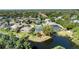 A beautiful waterfront property with a pool and an enclosed patio overlooking the lake at 6172 Knotty Pine Ct, Port Orange, FL 32127