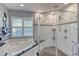Luxurious bathroom features a glass shower, soaking tub, and marble tile design at 6172 Knotty Pine Ct, Port Orange, FL 32127