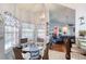 Bright breakfast nook with a table for four, a hanging light, and blue accents at 6172 Knotty Pine Ct, Port Orange, FL 32127