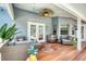 Relaxing covered patio featuring comfortable seating, a ceiling fan, and a view of the pool area at 6172 Knotty Pine Ct, Port Orange, FL 32127