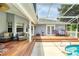 View of the covered deck and pool area with outdoor furniture and a grill perfect for entertaining at 6172 Knotty Pine Ct, Port Orange, FL 32127
