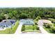 Well-maintained home with a lush green lawn, palm trees, and a manicured landscape at 6172 Knotty Pine Ct, Port Orange, FL 32127