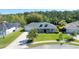 Charming one-story home featuring a well-manicured lawn and a welcoming front porch at 6172 Knotty Pine Ct, Port Orange, FL 32127