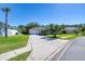 Beautiful single-Gathering home with a well-maintained front lawn, palm trees, and a welcoming driveway at 6172 Knotty Pine Ct, Port Orange, FL 32127