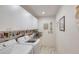 Functional laundry room with washer, dryer, counter space, and storage cabinets at 6172 Knotty Pine Ct, Port Orange, FL 32127