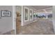 View of the club room featuring an open entrance, pool views, and comfortable seating at 1010 Megano Blvd, Deland, FL 32724