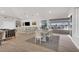An open-concept clubhouse featuring bar seating, dining area, and seamless access to a covered outdoor patio at 1010 Megano Blvd, Deland, FL 32724