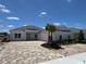 A beautifully built new construction home featuring a brick driveway and a well manicured front lawn at 1010 Megano Blvd, Deland, FL 32724