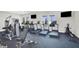 Well-equipped gym with treadmills, elliptical machines, weight machines, and multiple TVs at 1010 Megano Blvd, Deland, FL 32724