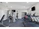 Bright gym featuring various exercise machines, free weights, and a mirrored wall at 1010 Megano Blvd, Deland, FL 32724