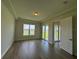 Bright living room featuring recessed lighting, tile floors, and sliding glass doors to a lake view at 1010 Megano Blvd, Deland, FL 32724