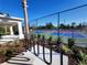Community tennis courts featuring colorfully painted playing surface, landscaping, and convenient bike rack at 1010 Megano Blvd, Deland, FL 32724
