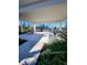 A community tennis pavilion featuring picnic tables and providing shade for spectators at 1010 Megano Blvd, Deland, FL 32724
