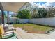 Spacious backyard featuring a paved patio, white vinyl fence, and room for outdoor activities at 1433 Mollie Rd, Daytona Beach, FL 32114