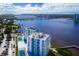 Stunning aerial view of the two towers surrounded by water, tennis courts and convenient parking at 925 N Halifax Ave # 1105, Daytona Beach, FL 32118