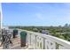 Balcony seating and table set overlooking a cityscape at 925 N Halifax Ave # 1105, Daytona Beach, FL 32118