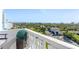 Balcony view overlooking lush green trees, and city buildings, under a clear blue sky at 925 N Halifax Ave # 1105, Daytona Beach, FL 32118