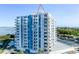 Exterior shot of a high-rise condo with balconies and views of the surrounding cityscape and water at 925 N Halifax Ave # 1105, Daytona Beach, FL 32118