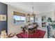 This dining room has a view of the water and a decorative chandelier at 925 N Halifax Ave # 1105, Daytona Beach, FL 32118