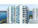 Condominium showcasing balconies and windows, offering scenic waterfront views at 925 N Halifax Ave # 1105, Daytona Beach, FL 32118