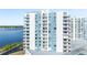 High-rise condominium building showcasing balconies with views, near a tennis court at 925 N Halifax Ave # 1105, Daytona Beach, FL 32118