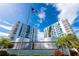 Wide angle shot of manicured landscaping in front of high-rise condos at 925 N Halifax Ave # 1105, Daytona Beach, FL 32118