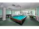 Spacious game room features a pool table, ping pong, and foosball for hours of entertainment at 925 N Halifax Ave # 1105, Daytona Beach, FL 32118