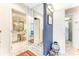 This hallway is next to the main bathroom and has a mirror on the wall at 925 N Halifax Ave # 1105, Daytona Beach, FL 32118